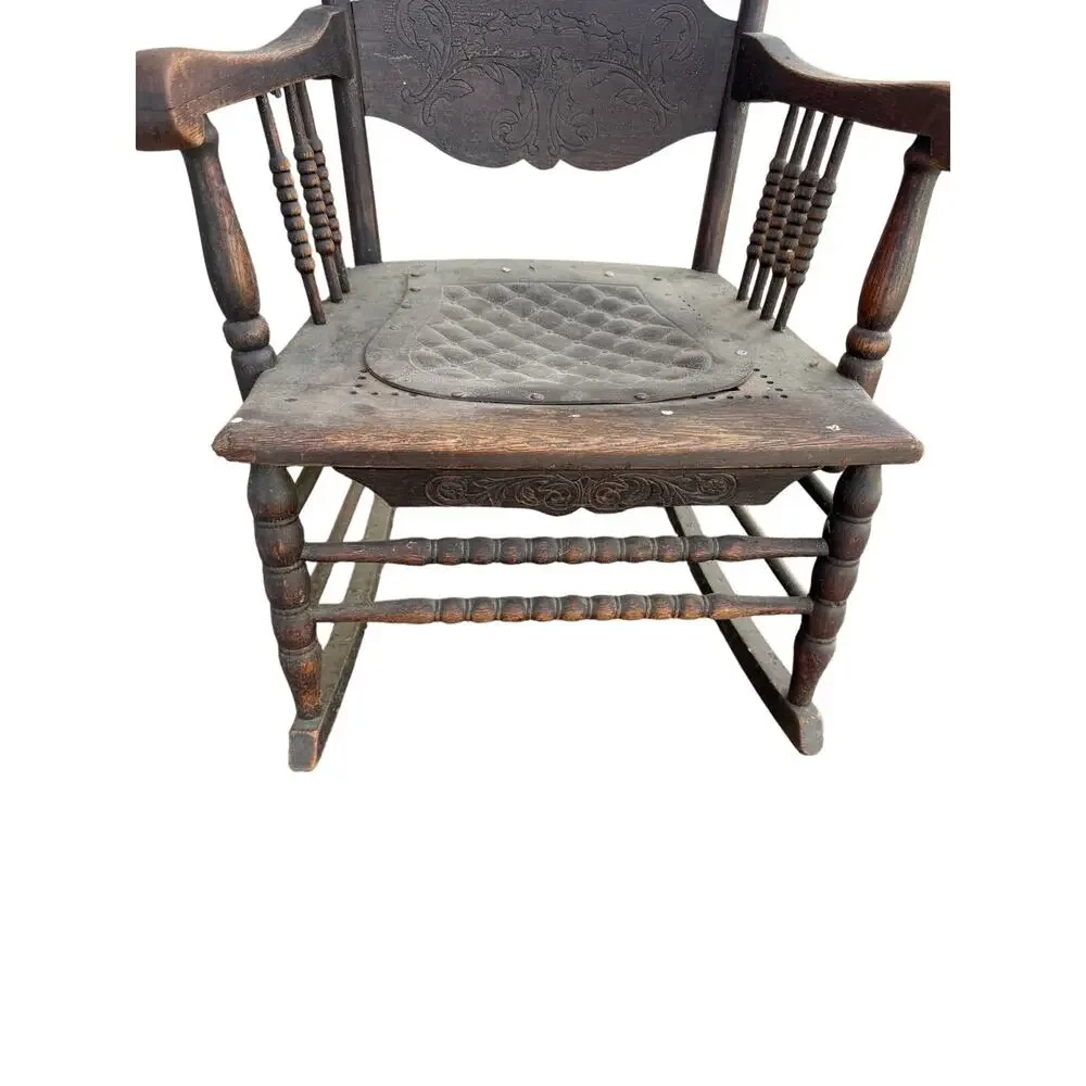 Antique Spindle Rocking Chair With Carvings and Cutout accent